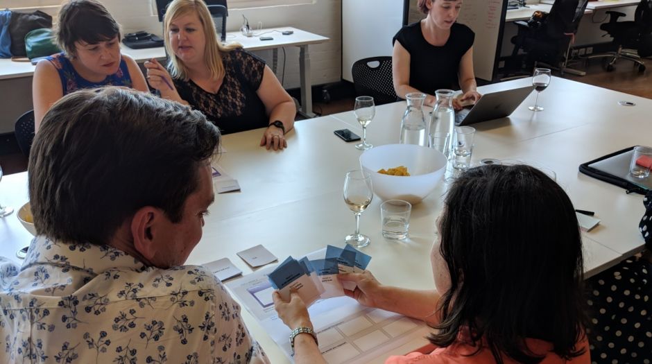 People try the ThinkPlace game Cards Against Neutrality